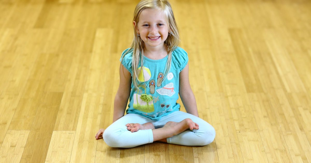 Children practicing yoga together at Revolution Yoga in Rockville Centre