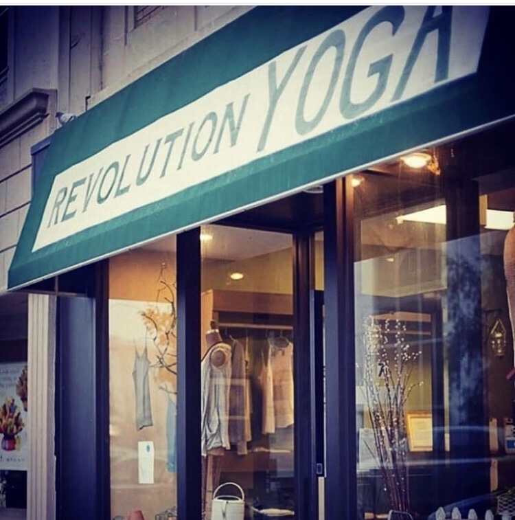 Revolution Yoga storefront sign at 7 North Village Ave, Rockville Centre, NY