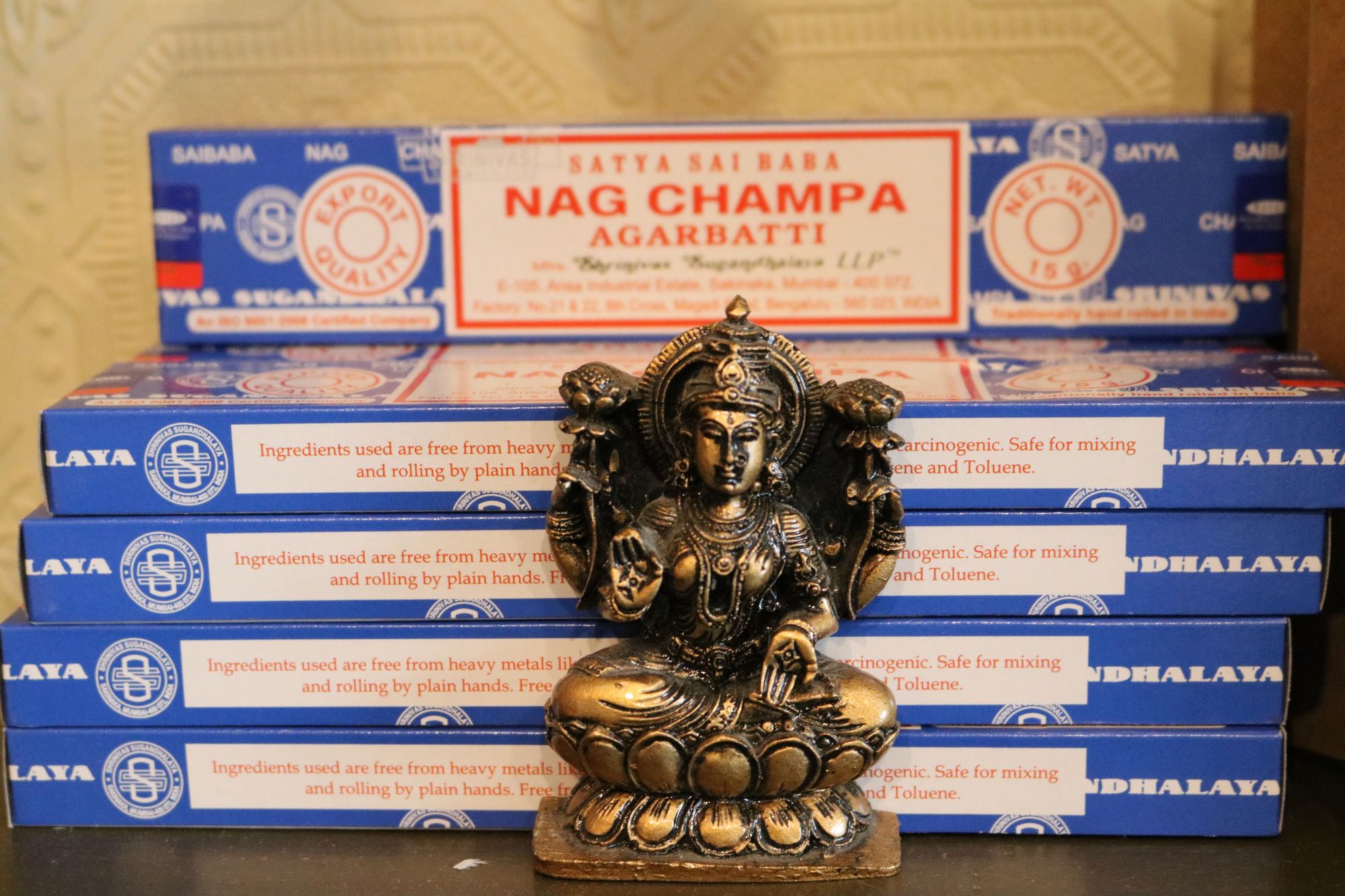Nag Champa incense and a brass deity statue in the shop