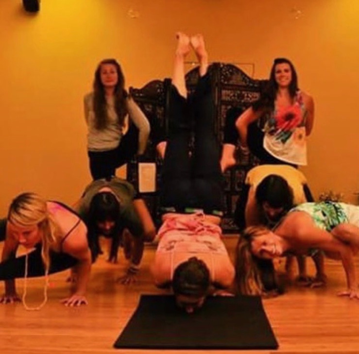 Group of trainees in a playful group pose