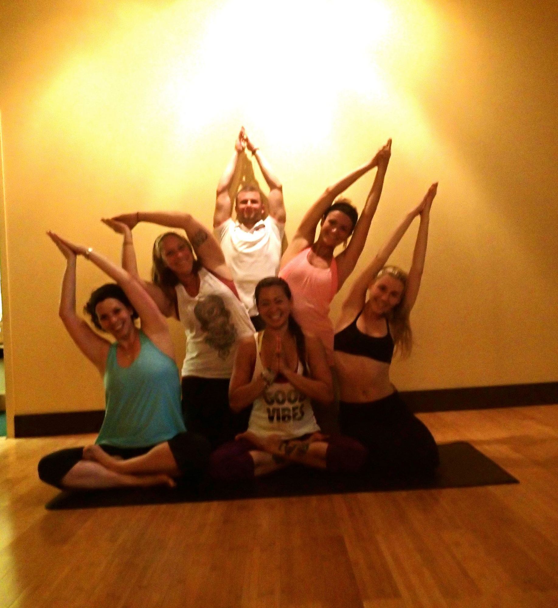 Instayogi workshop group posing with arms raised