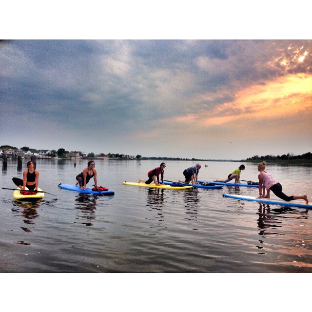 Stand-up paddleboard yoga on the water