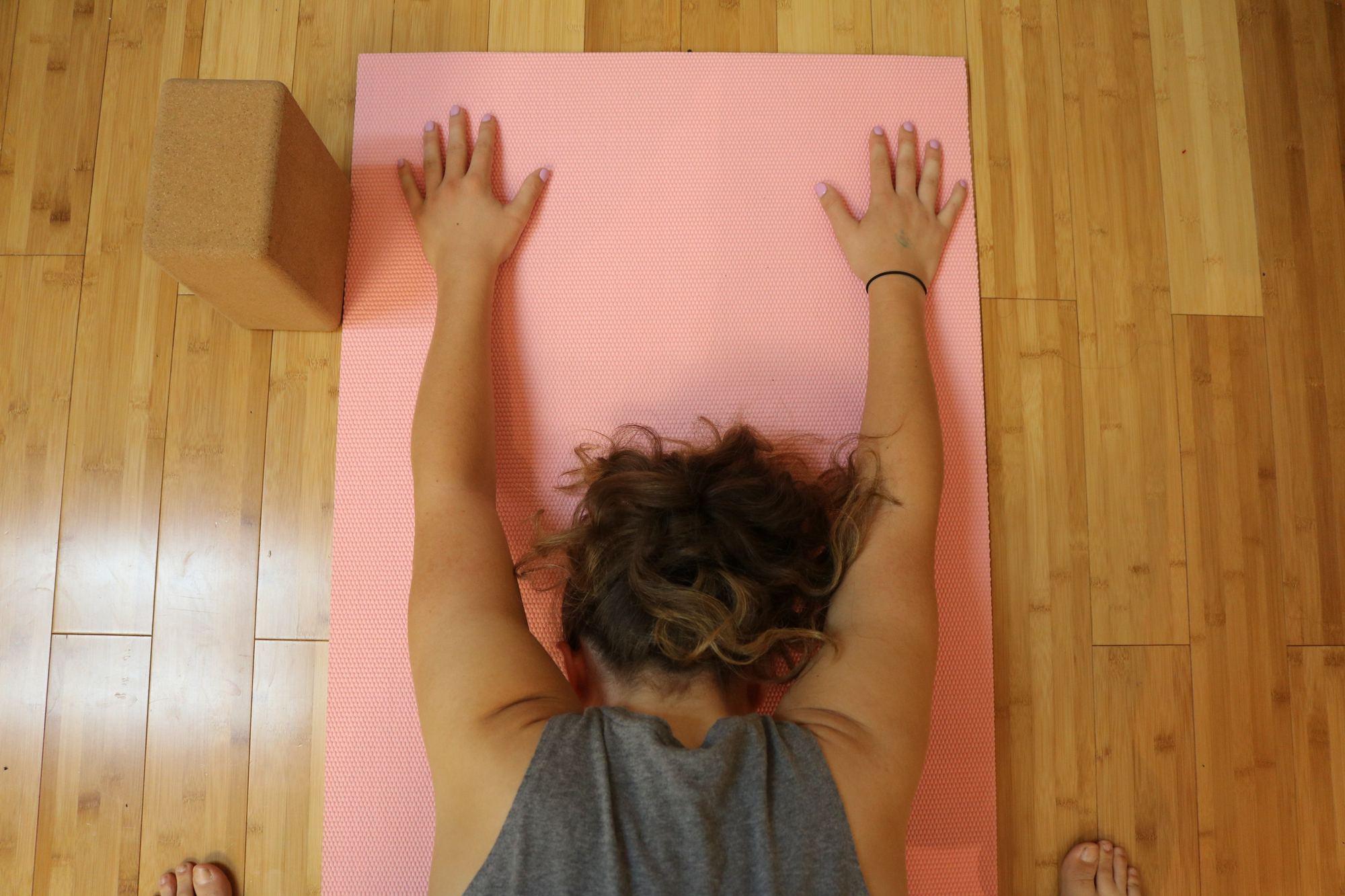 Student resting in child's pose during a gentle private session