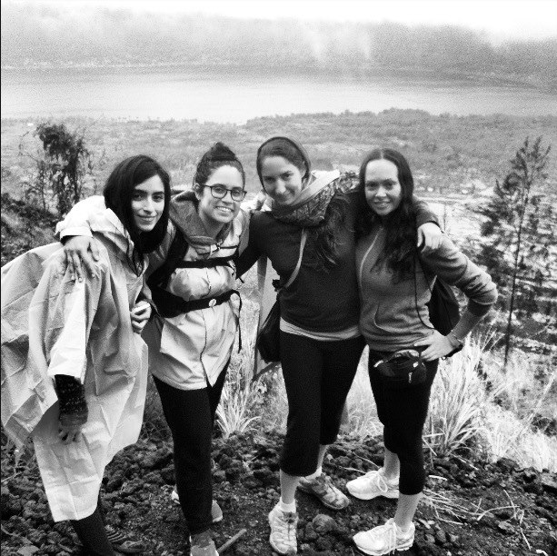 Four women smiling on a hike during a weekend women's retreat