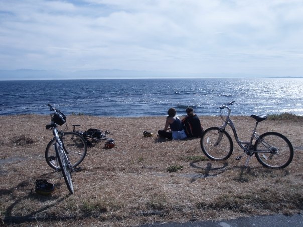 Amanda DiGiovanna with bicycles on the beach