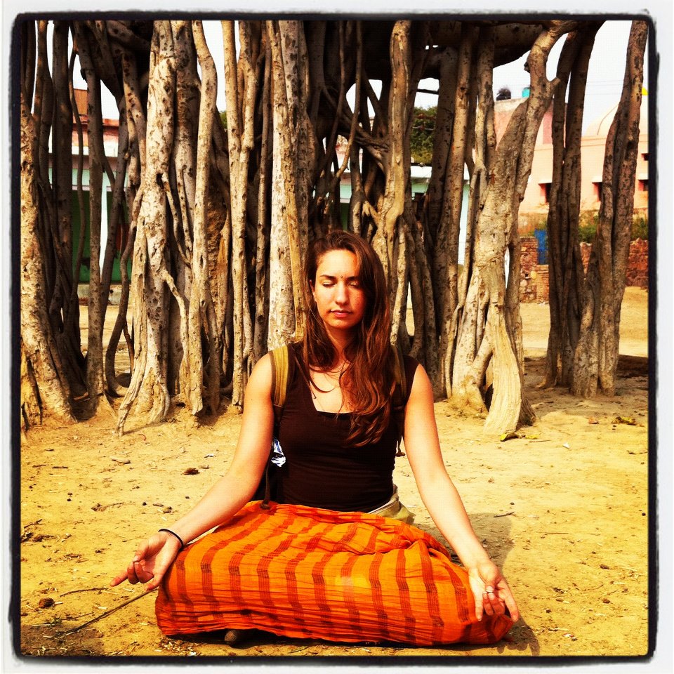 Amanda DiGiovanna meditating beneath a banyan tree