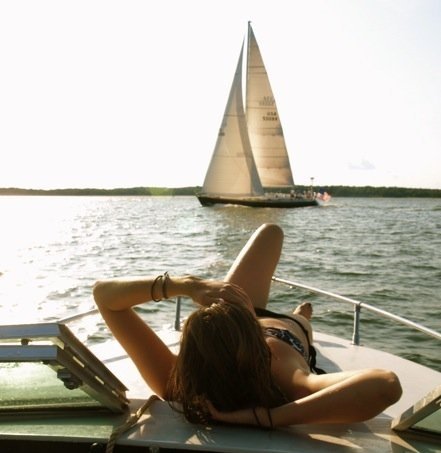 Amanda DiGiovanna relaxing on a sailboat