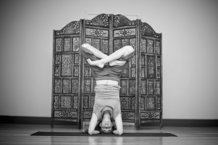 Amanda DiGiovanna in headstand with lotus legs, black and white