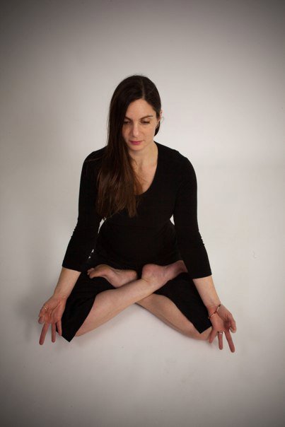 Lisa Ries seated in meditation