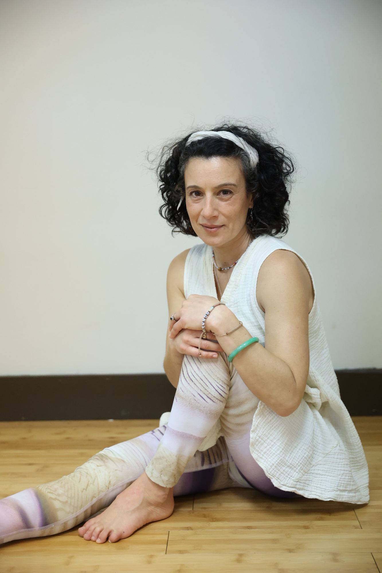 Micheline DeBono seated on the studio floor