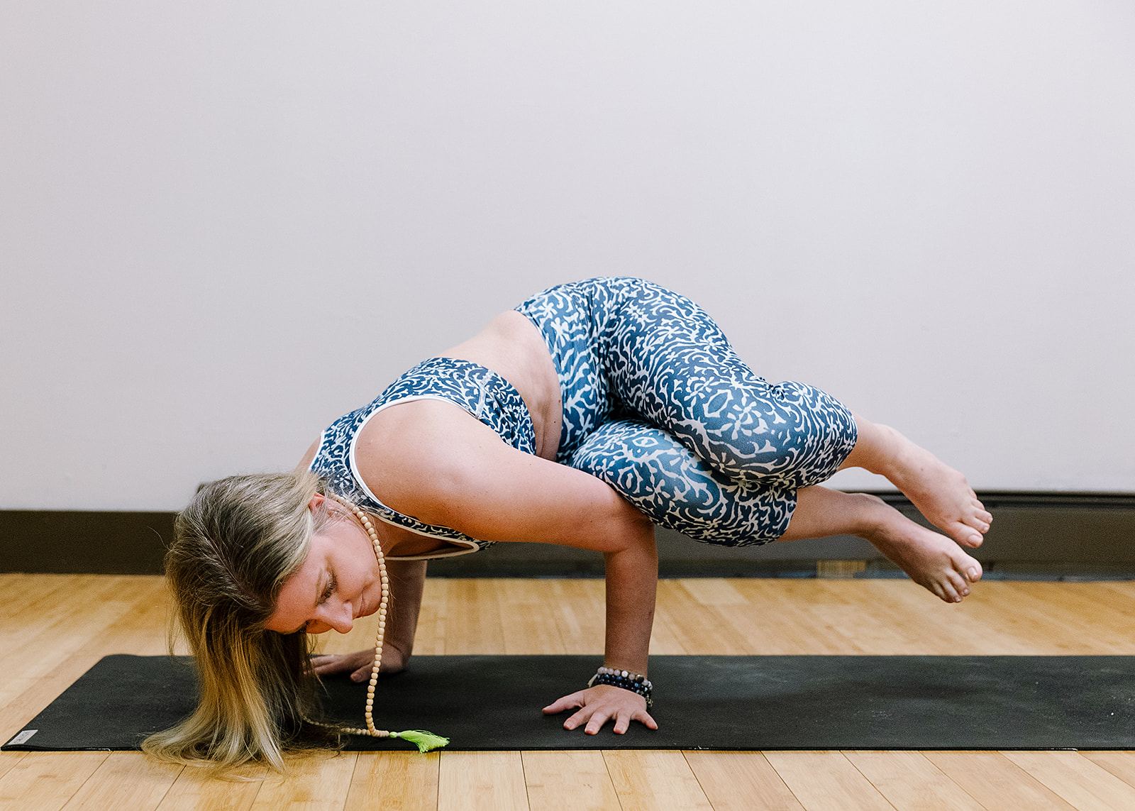 Michelle Levitsky in crow pose in the studio