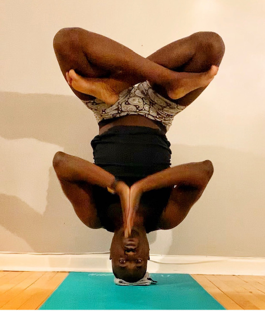Rahmon Habeeb in headstand with crossed legs